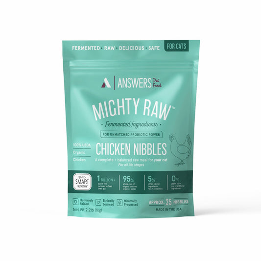 Teal package of Answers Pet Food Mighty Raw Chicken Nibbles for cats on a white background